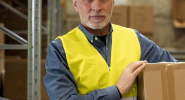 man-warehouse-carrying-box