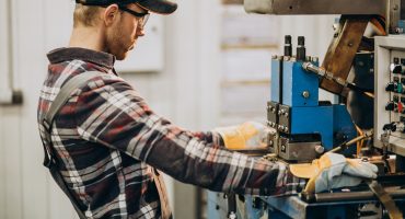 Man working on steel fatory and equipment for steel production